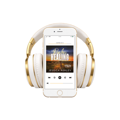 White and gold headphones with a smartphone displaying an audiobook on a white background