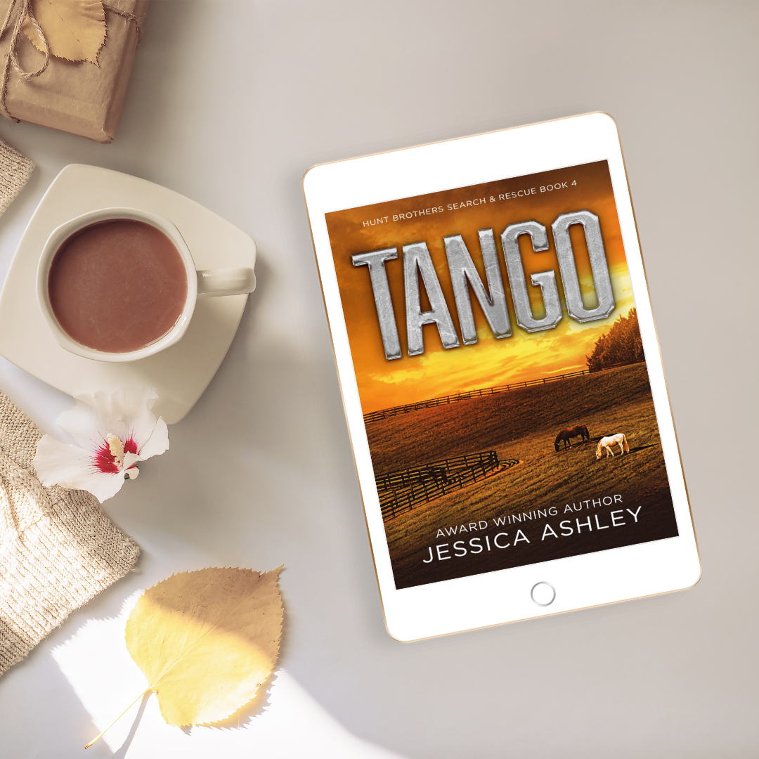 Tablet displaying the book 'Tango' by Jessica Ashley on a table with a cup of coffee and a flower.